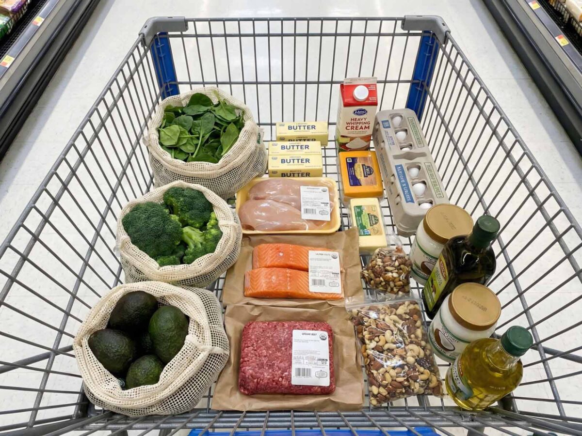 Shopping cart filled with keto-friendly groceries for beginners starting the diet